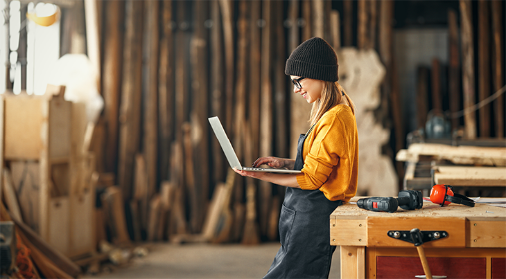 Woman looking for reclaimed wood